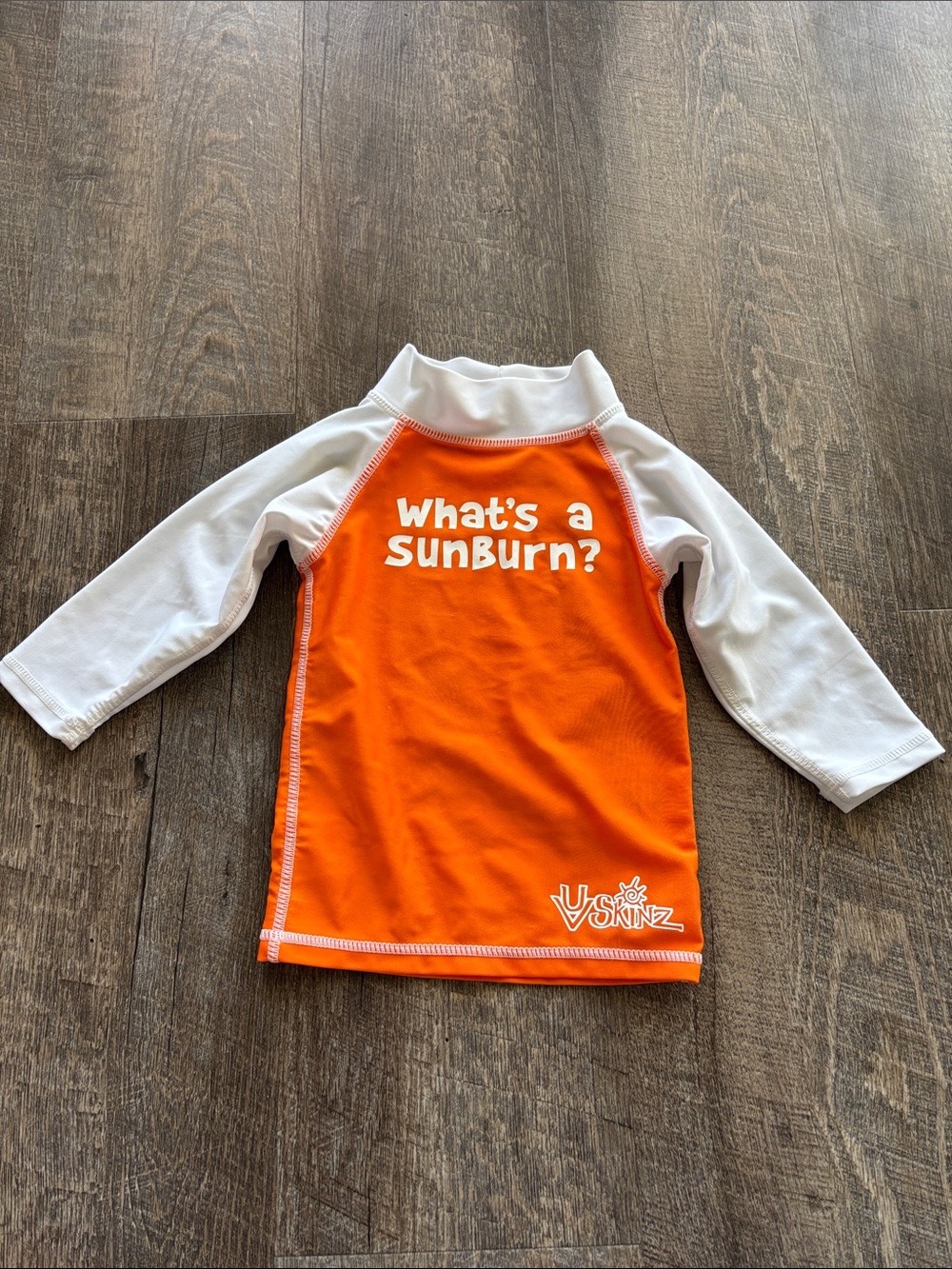 Skin Orange & White Kids Rash Guard with "What's a SunBurn?" Print